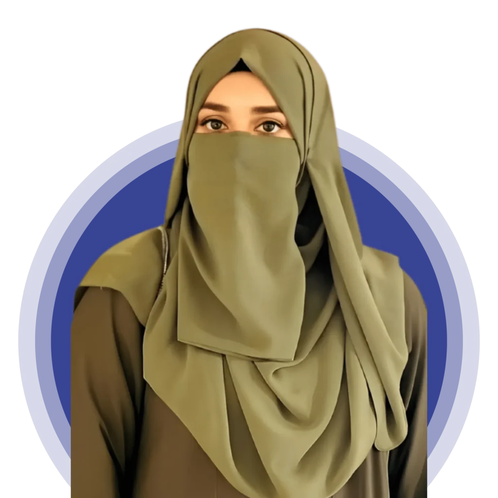 komal farooq: A portrait of a focused woman with red hair in a ponytail and round glasses, wearing a mustard-yellow shirt, working on a silver laptop in a bright office environment.